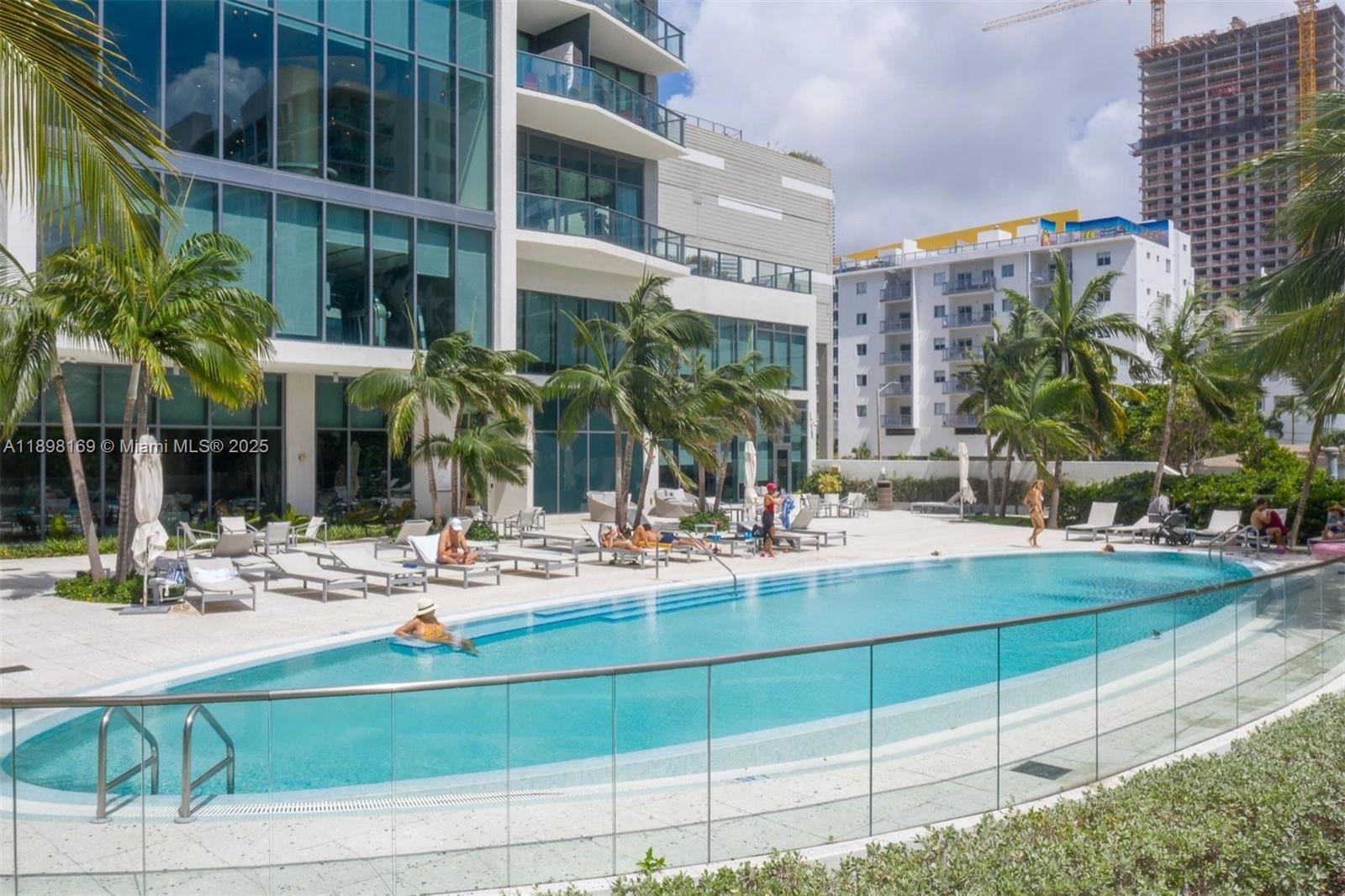 460 Northeast 28th Street, Unit 1901 Miami, FL 33137 - Photo 34 of 34 a view of a building with a swimming pool and sitting area