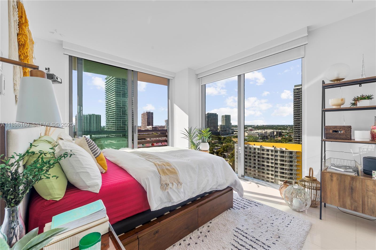 460 Northeast 28th Street, Unit 1901 Miami, FL 33137 - Photo 6 of 34 a bedroom with a bed and a window