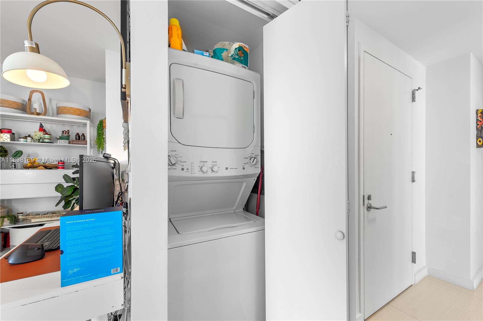 460 Northeast 28th Street, Unit 1901 Miami, FL 33137 - Photo 10 of 34 a utility room with dryer and washer