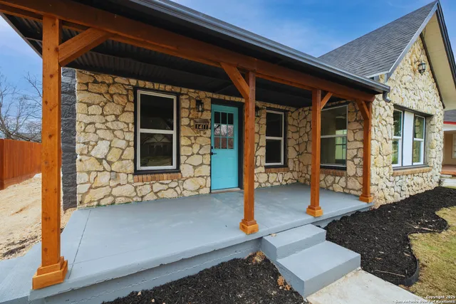 a living room with furniture rug and window