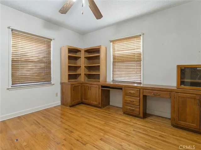 a kitchen with a cabinets and wooden floor