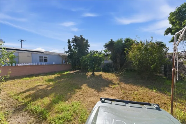 a view of a lake with a house in the background