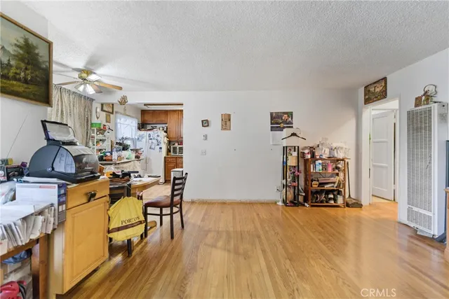 a view of a livingroom with furniture and a flat screen tv