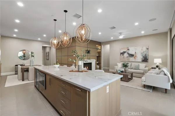 a dining room with furniture a window and stainless steel appliances