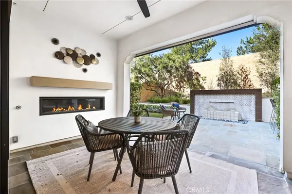 a view of house with a outdoor seating area