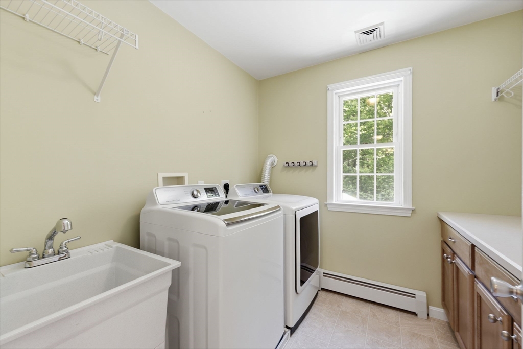 345 Bragg Road Warren, MA 01585 - Photo 31 of 41 a utility room with dryer and washer