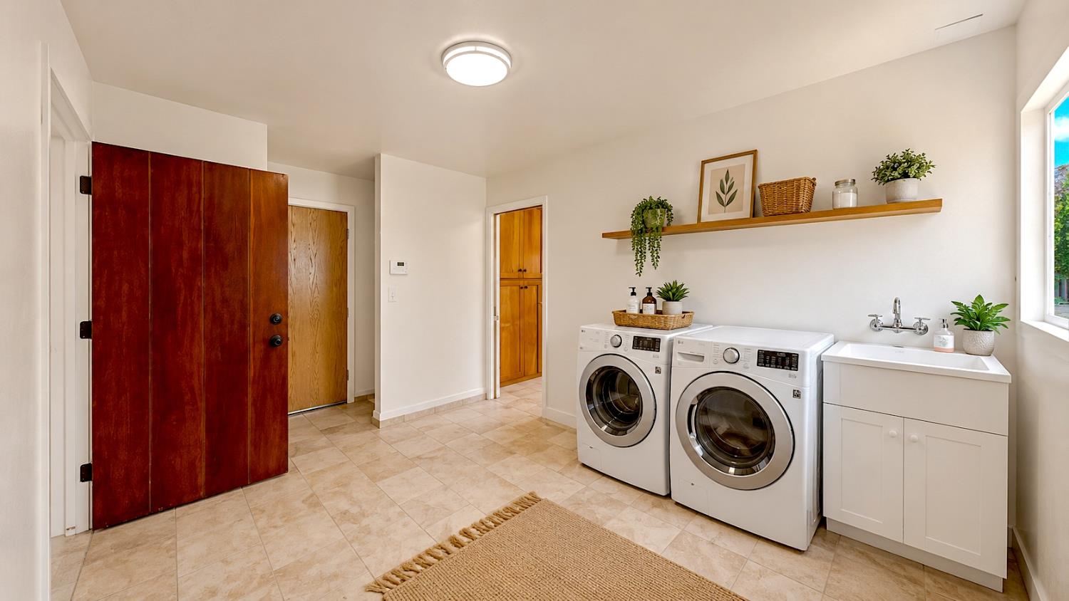 13626 West Harding Road Turlock, CA 95380 - Photo 26 of 43 AI Staged. With a little work this is what the large laundry room can look like