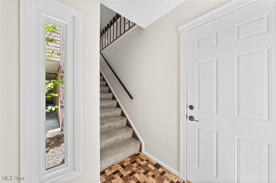 Stairway featuring carpet