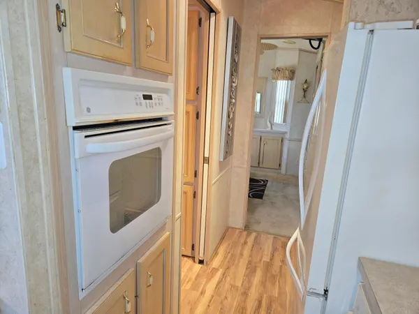 a view of a kitchen from the hallway