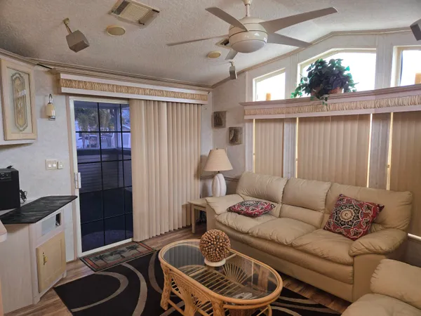 a living room with furniture and a window