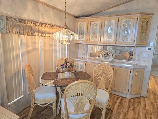 a dining room with furniture and window