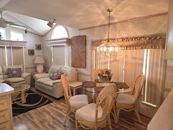 a bedroom with furniture and a chandelier