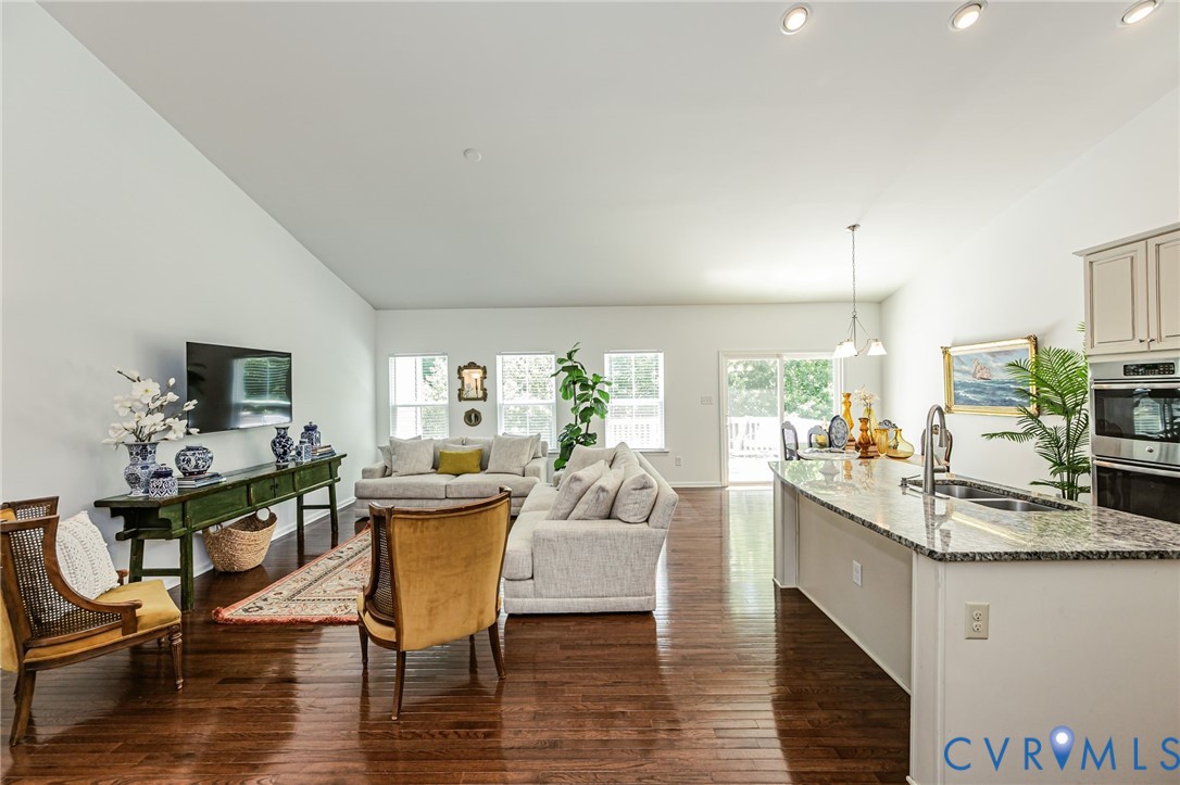 7435 Wicks Road Williamsburg, VA 23188 - Photo 14 of 82 Open-concept living space featuring wood-finish fl