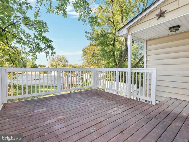 front view of a house with a tree