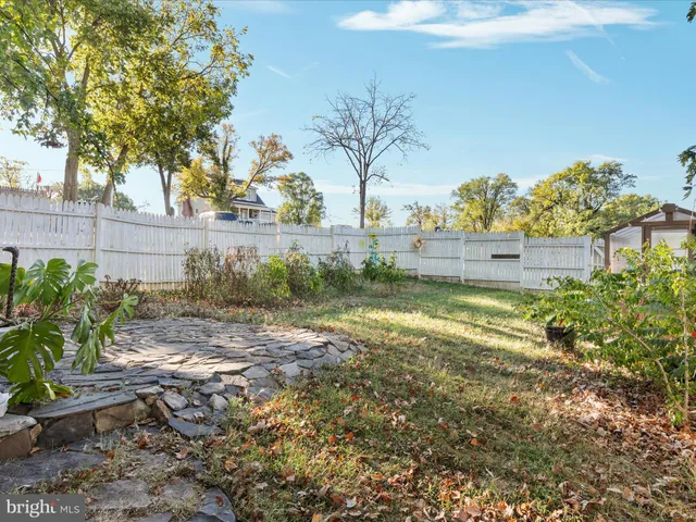 a view of house with a deck and furniture