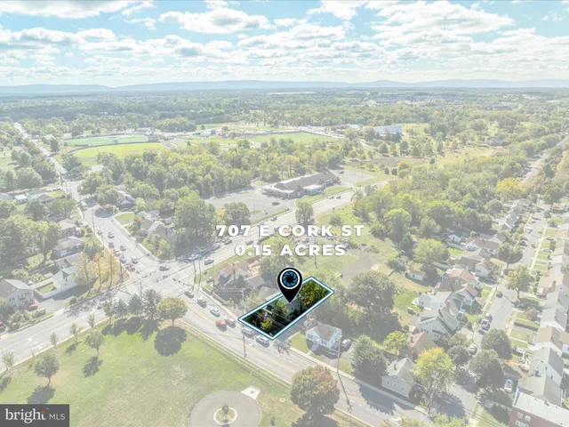a view of a balcony with couches and city view