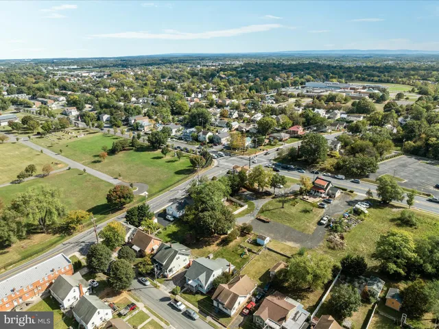 a view of a brick house with glass windows
