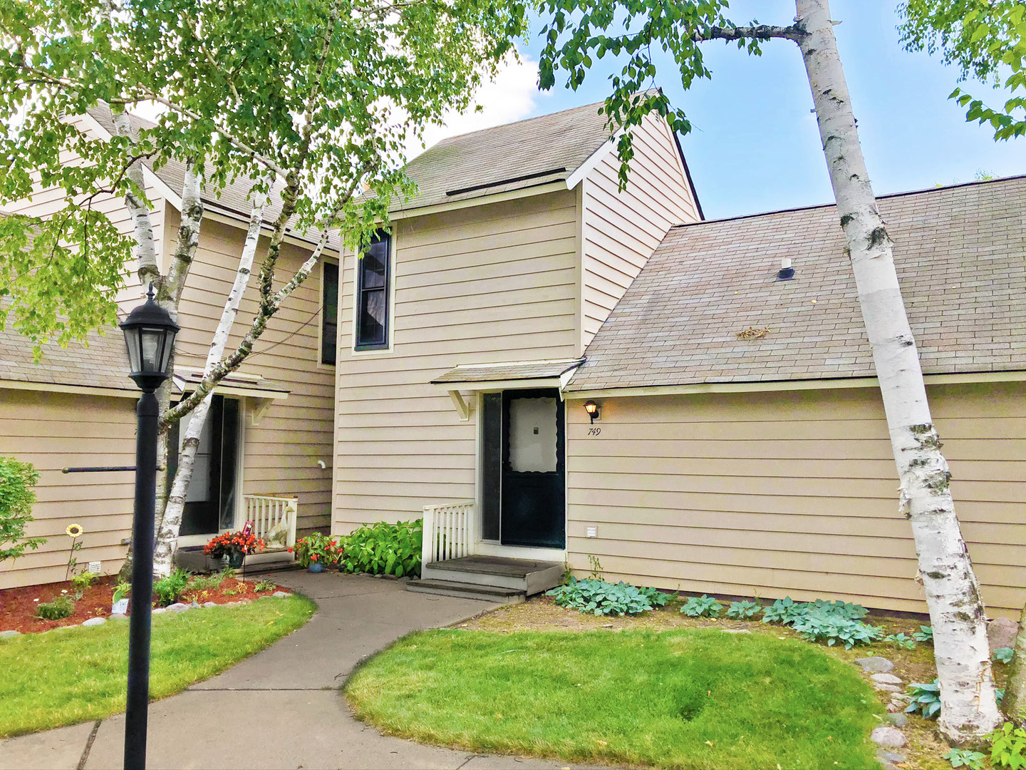 749 Shepard Court Gurnee, IL 60031 - Photo 1 of 22 a front view of a house with a garden and plants
