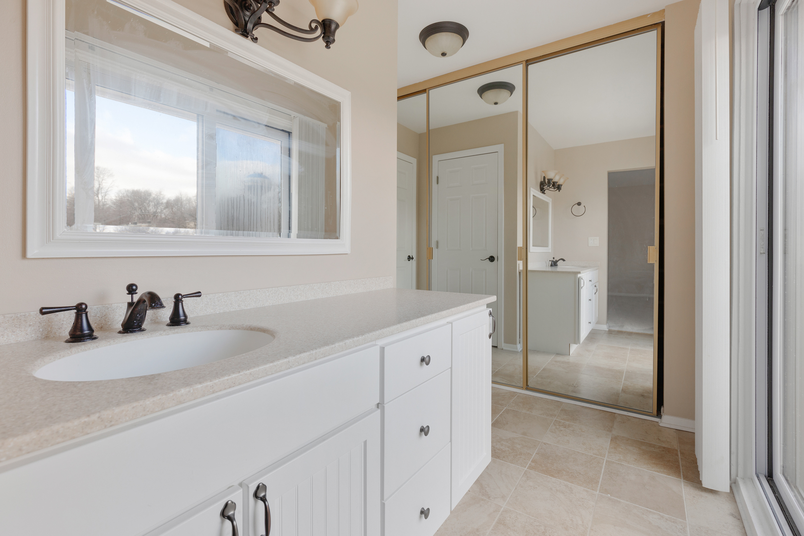 749 Shepard Court Gurnee, IL 60031 - Photo 16 of 22 a bathroom with a sink and a mirror