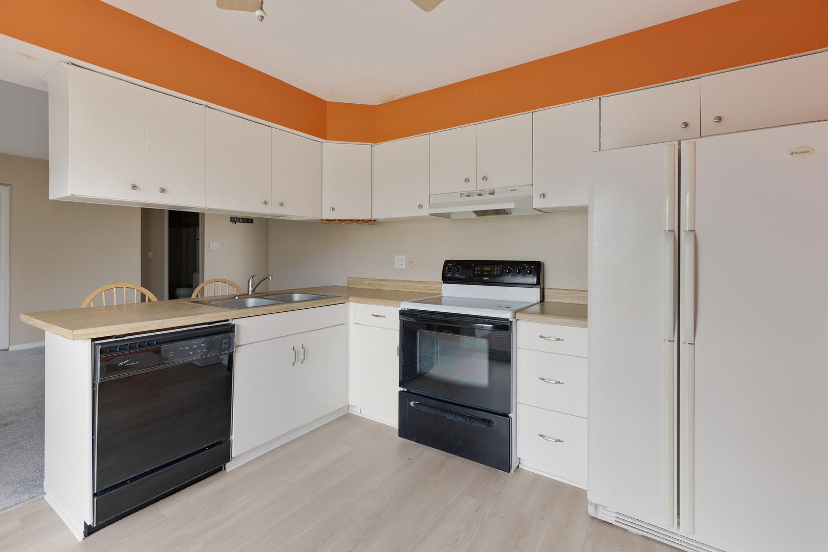 749 Shepard Court Gurnee, IL 60031 - Photo 10 of 22 a kitchen with white cabinets and white appliances