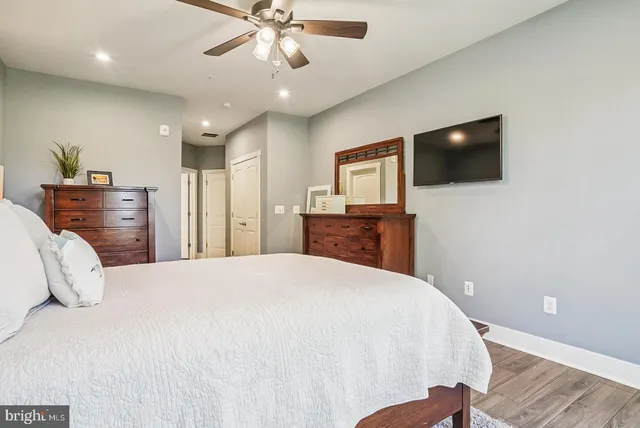 a bathroom with a double vanity sink and mirror with shower