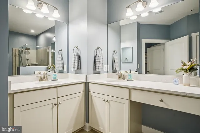 a view of a workspace with furniture and a potted plant