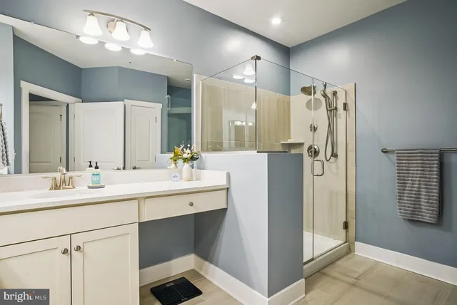 a bathroom with a sink toilet and mirror