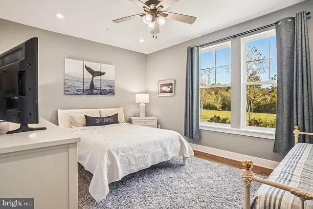 a view of a chairs and table in patio with a yard