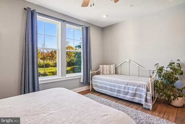 a view of a lake with houses in the back