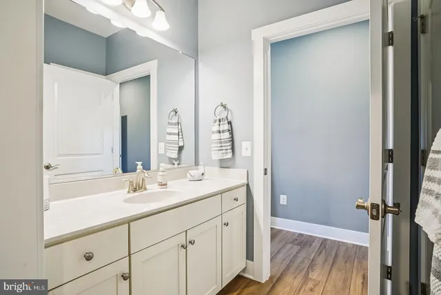 a dining room with furniture a rug and a large window