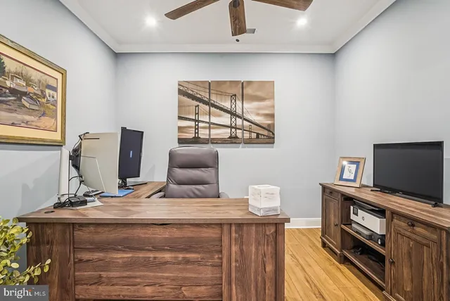 a large dining hall with stainless steel appliances granite countertop a stove and cabinets