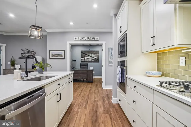 a living room with furniture a flat screen tv and a large window
