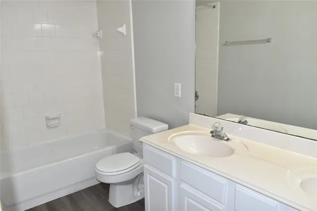 a bathroom with a sink a toilet and a bathtub