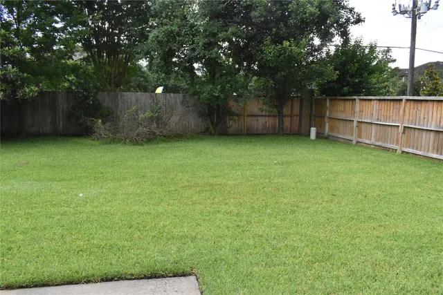 a view of backyard with green space