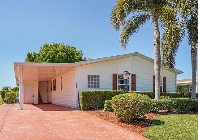 front view of a house with a garden