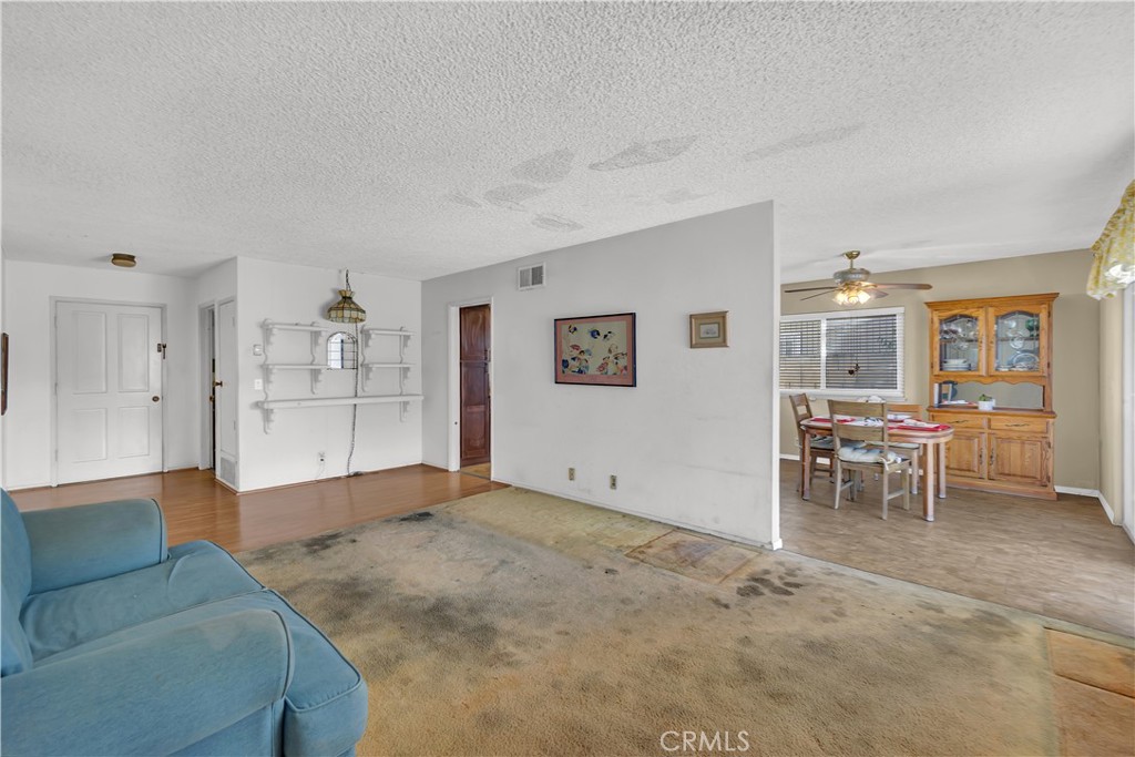 4422 East Silverleaf Avenue Orange, CA 92869 - Photo 11 of 27 a living room with furniture and view of kitchen