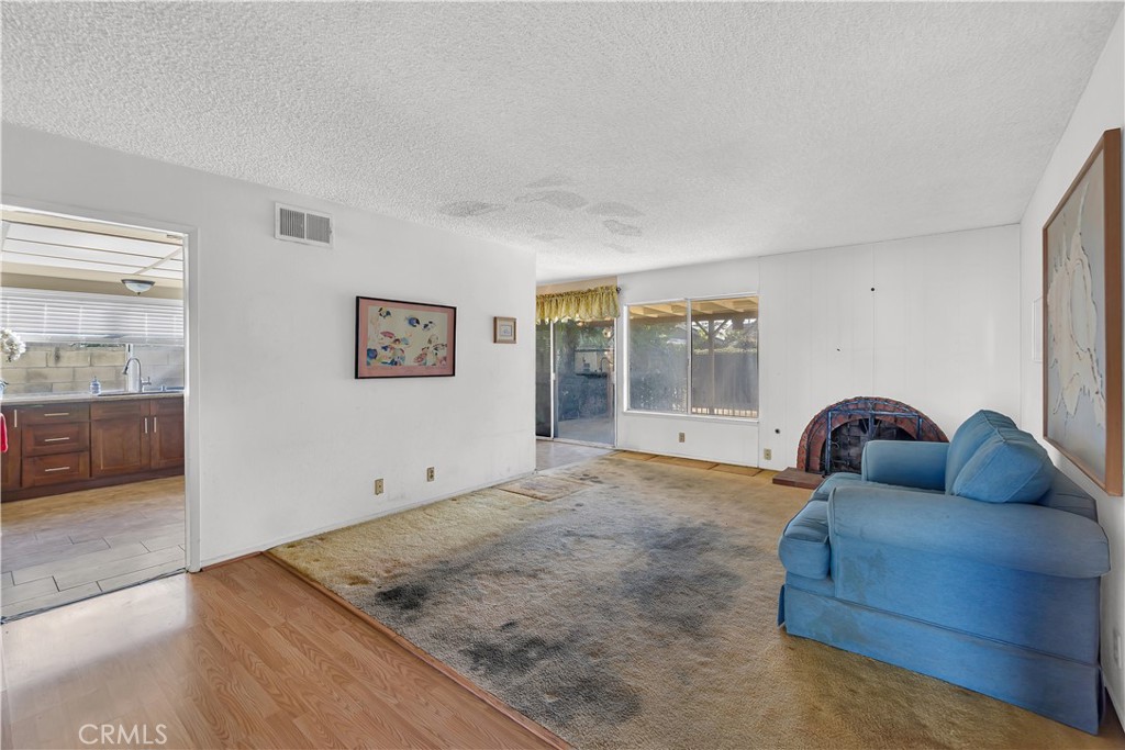 4422 East Silverleaf Avenue Orange, CA 92869 - Photo 12 of 27 a living room with furniture and window