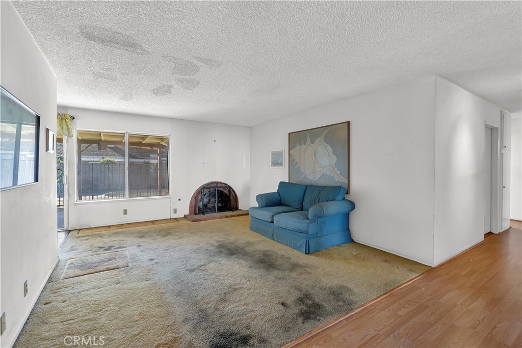 4422 East Silverleaf Avenue Orange, CA 92869 - Photo 13 of 27 a living room with furniture and a window
