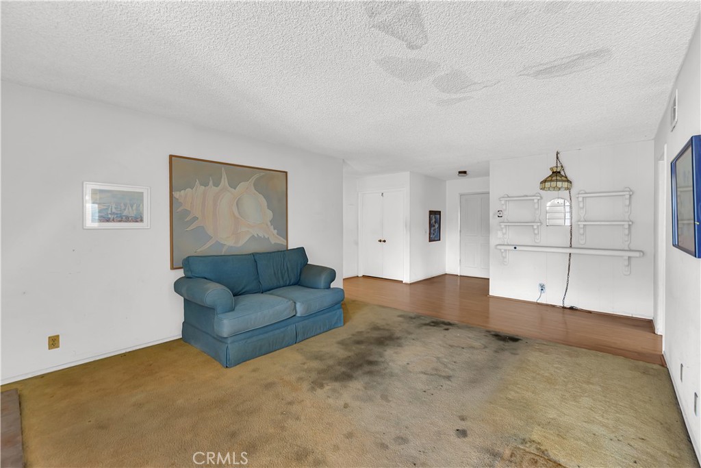 4422 East Silverleaf Avenue Orange, CA 92869 - Photo 14 of 27 a living room with furniture and a chandelier
