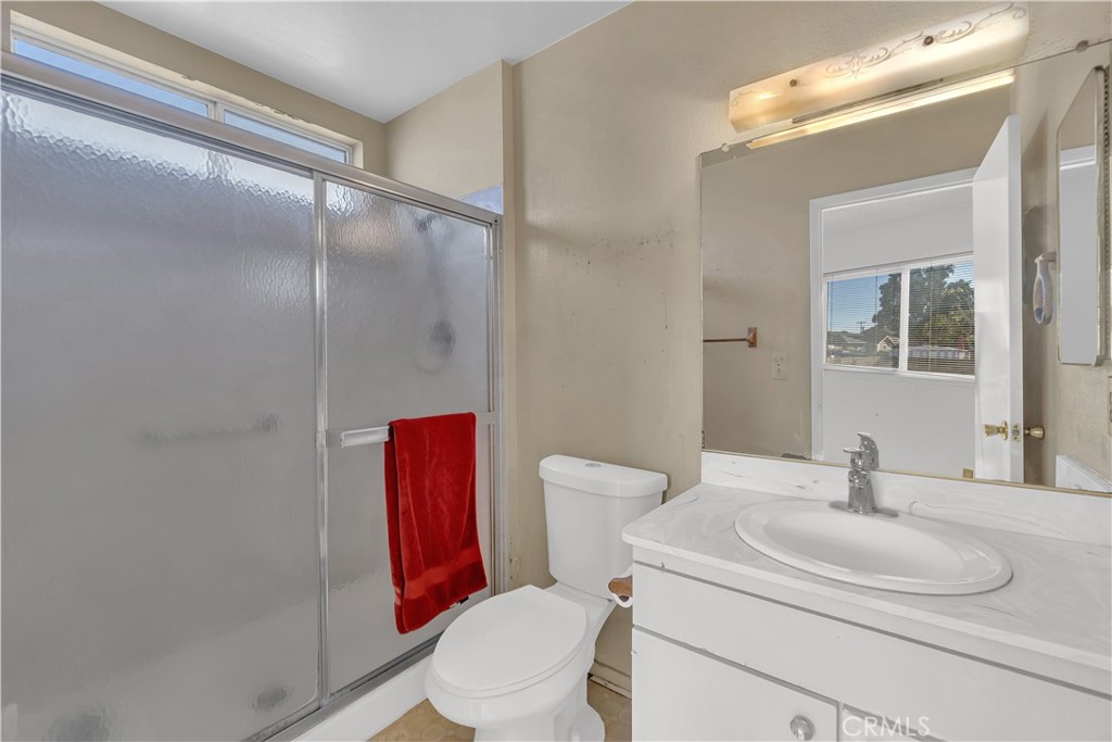 4422 East Silverleaf Avenue Orange, CA 92869 - Photo 17 of 27 a bathroom with a toilet sink shower and mirror