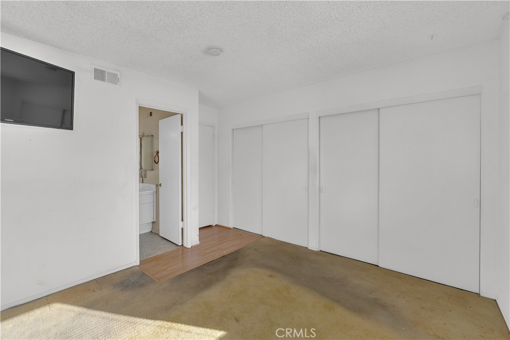 4422 East Silverleaf Avenue Orange, CA 92869 - Photo 18 of 27 a view of a livingroom with wooden floor and flat screen tv