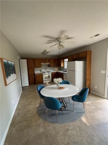 a view of a dining room with furniture