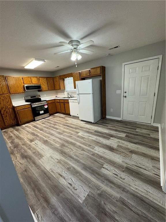 1727 Oak Grove Church Road, Unit B Carrollton, GA 30117 - Photo 5 of 13 a view of a room with furniture and a ceiling fan