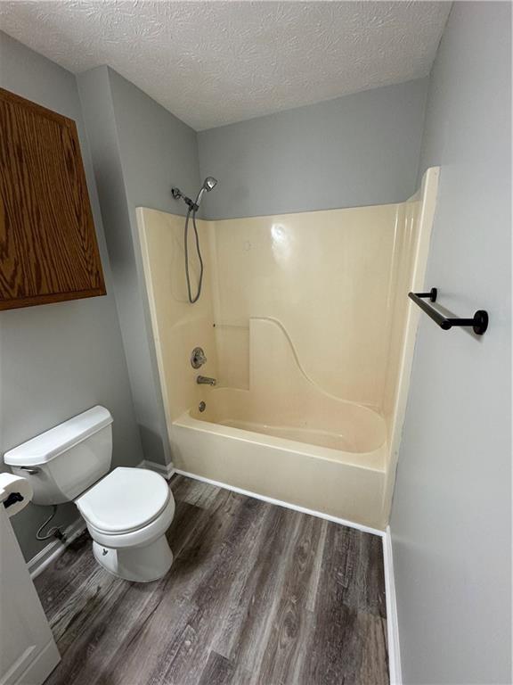 1727 Oak Grove Church Road, Unit B Carrollton, GA 30117 - Photo 8 of 13 a bathroom with a toilet and a shower