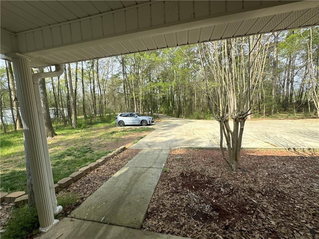 1727 Oak Grove Church Road, Unit B Carrollton, GA 30117 - Photo 10 of 13 a backyard of a house with lots of green space and seating