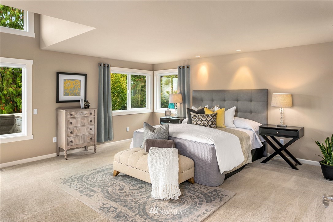 110 N 50th Street Seattle, WA 98103 - Photo 16 of 25 a bed room with a bed and a couch