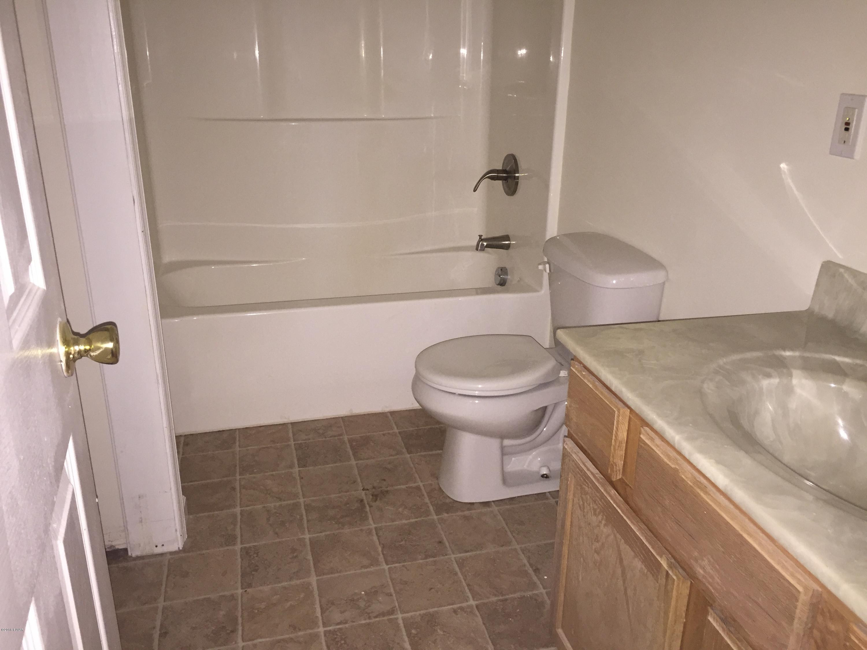 158 Yale Road Milford, PA 18337 - Photo 7 of 13 a bathroom with a sink a toilet and shower