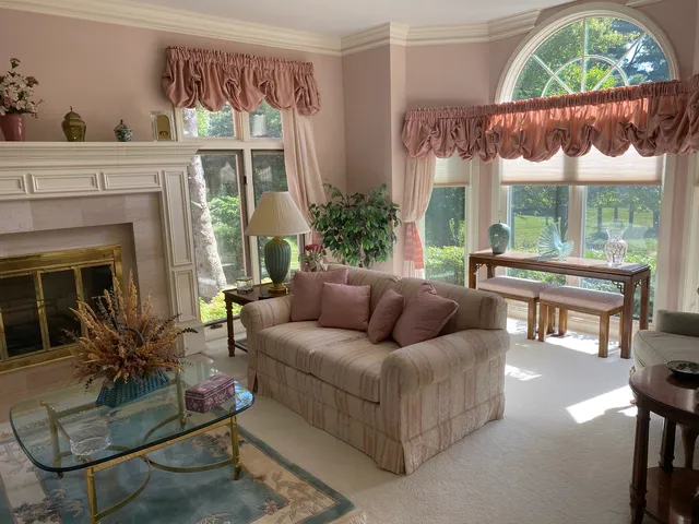 a bedroom with a bed and ceiling fan