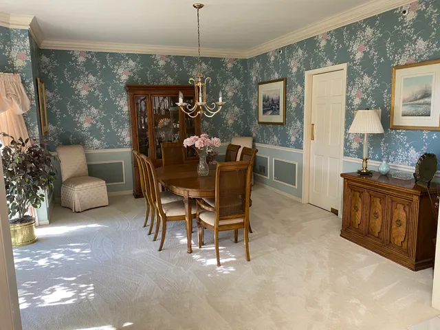 a bedroom with a bed and chandelier