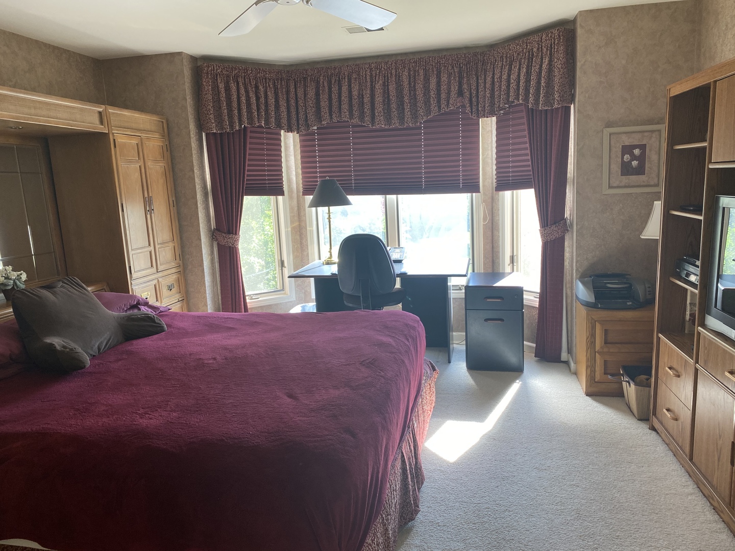 5801 Port Clinton Road Long Grove, IL 60047 - Photo 21 of 38 a bedroom with a bed a flat screen tv and a large window